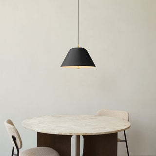 Metal cone pendant in interior — metallic modern ceiling lamp