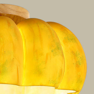 Yellow resin pumpkin ceiling fixture, cozy ambient modern design