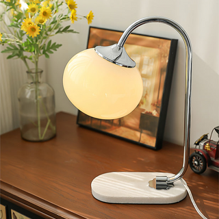 Marshmallow table lamp illuminated — glass shade warm glow