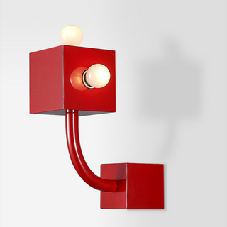 Red retro metal wall sconce illuminated — vintage cozy lamp