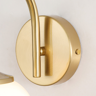 Gold finish modern pink glass bedroom wall sconce close-up