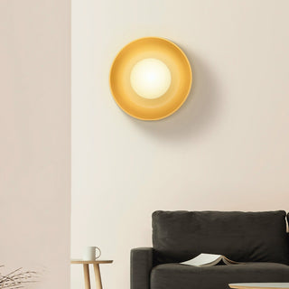 Minimalist white ceramic wall lamp illuminated — modern living