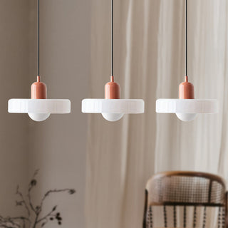 Modern Bauhaus three-lamp pendant over dining area