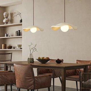 Resin pendant with hat-form shade over kitchen island