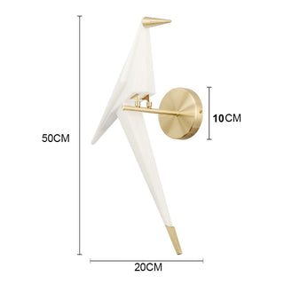 Golden bird wall lamp on interior wall — stylish gold sconce