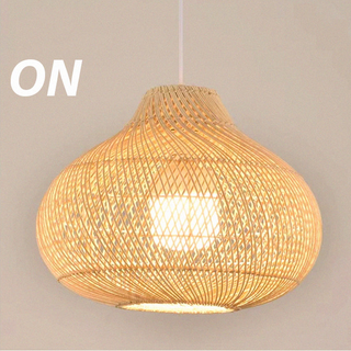 Boho rattan pendant in interior — wood finish warm glow hanging lamp