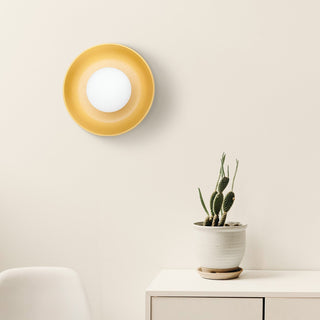 White ceramic wall sconce detail — minimalist modern living room