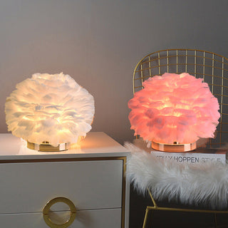 Feather lamp illuminated — rounded plush warm glow