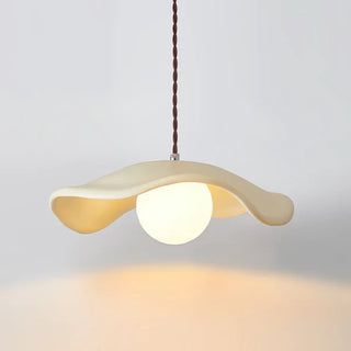 Pendant with wide-brim resin hat shade over dining table