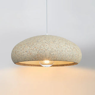Beige stone pendant hanging in contemporary dining room