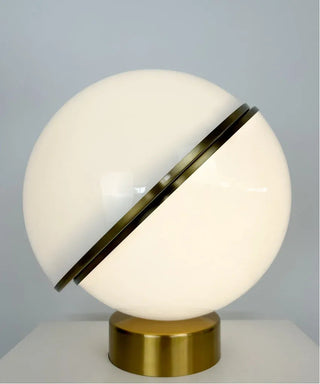 White and gold lamp illuminated — warm elegant ambient glow