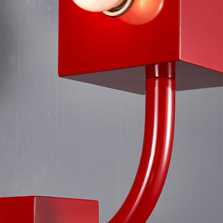 Vintage red wall sconce in bedroom — retro metal lamp