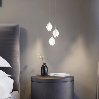 Stylised bloom pendant in interior — multi-head dining lamp
