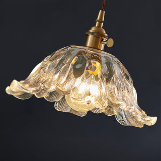 Clear glass flower pendant in interior — brass creative lamp