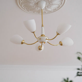 Black brass medieval chandelier side — modern glass bedroom warm