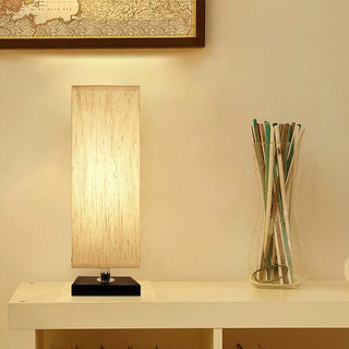 Elegant ivory tower table lamp — soft glow close-up