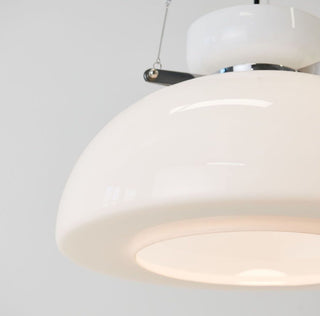 White frosted glass dome pendant casting soft warm glow