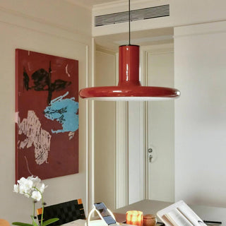 Red pendant lamp in interior — saucer metal dining ceiling light