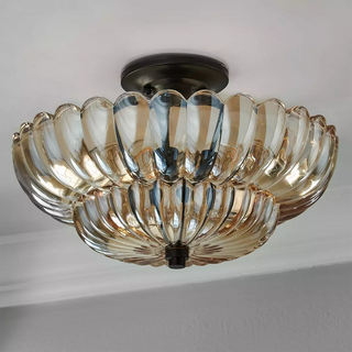 Retro amber glass ceiling fixture – close-up of aged brass hardware