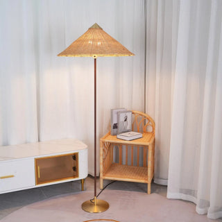 Vintage woven rattan lamp detail — tall warm reading light
