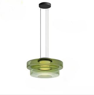 Modern adjustable glass pendant casting warm dining light