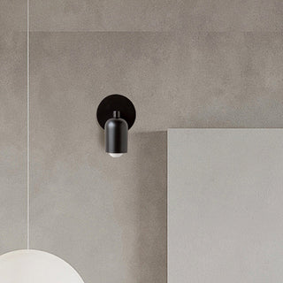 Small stained glass modern wall sconce close-up — coloured shade