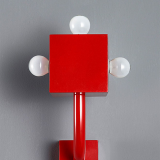 Red retro wall sconce detail — vintage metal cozy wall light