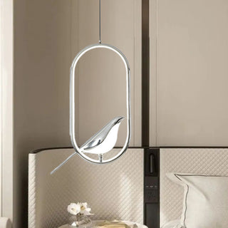 Modern pendant with gold bird sculpture and oval LED body