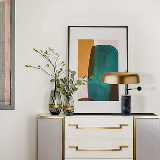Tall black metal lamp illuminated — marble base warm ambient