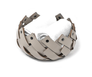 woven leather basket chrome pins decorative bathroom storage close-up