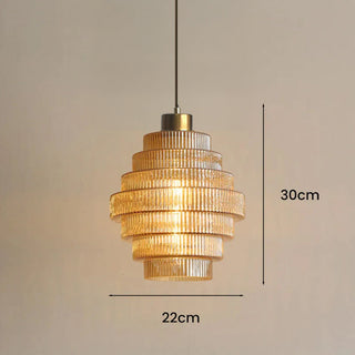 Adjustable brass pendant with decorative striped glass shade