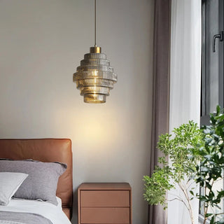 Vintage brass pendant with bottle glass shade over counter