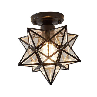 Metal star-shaped ceiling lamp illuminated, dining room