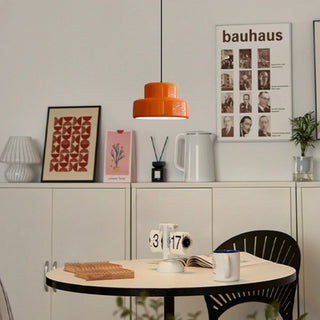 Vintage orange pendant over dining room table