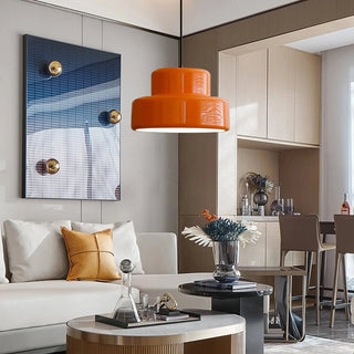 Mid-century pendant in vibrant orange with warm glow