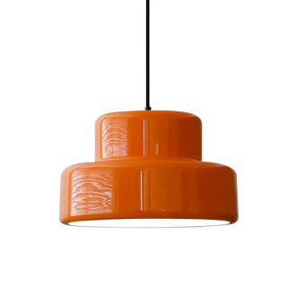 Mid-century orange hanging lamp over dining table