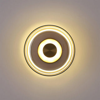 Modern round glass wall sconce in living room — clear iron
