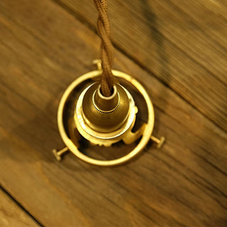 Retro amber pendant casting golden warm light in living room