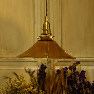 Amber glass pendant showing warm tinted glow detail