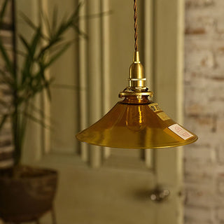 Amber-tinted retro glass pendant for warm kitchen lighting