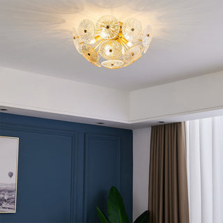Modern gold starburst chandelier side — glass sparkling warm glow