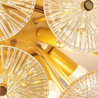 Modern starburst gold chandelier ambient — glass sparkling warm glow