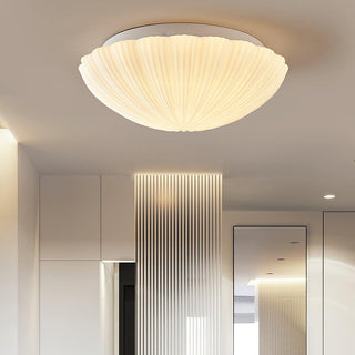 Cream vintage seashell ceiling lamp – coastal light installed