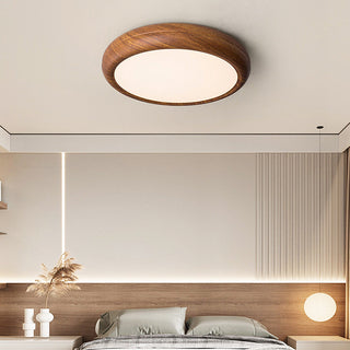 Wood tone LED ceiling fixture – round Scandinavian style bedroom