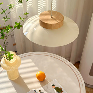 Modern cream pendant over kitchen counter with soft glow