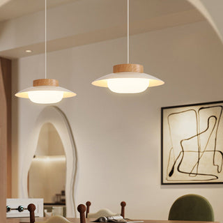 Cream pendant light casting warm diffused glow