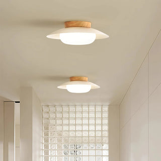 Round cream ceiling fixture installed, energy efficient LED