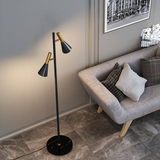 Adjustable black floor lamp illuminated — two heads warm