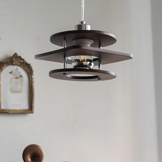 Retro walnut pendant in interior — small metal dining lamp