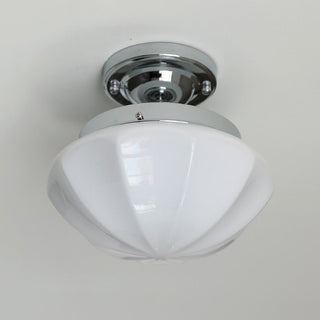 Vintage milky white hallway ceiling lamp illuminated, warm glow